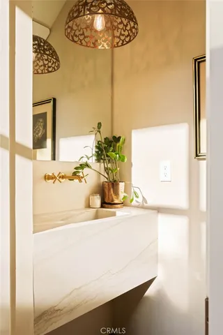 a bathroom with a sink and a mirror