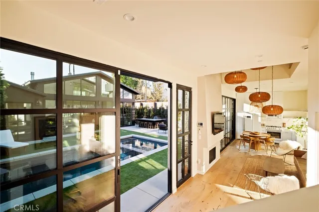 a view of living room with furniture and floor to ceiling window