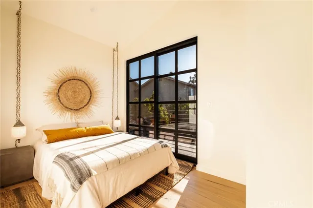 a bedroom with a bed and a window