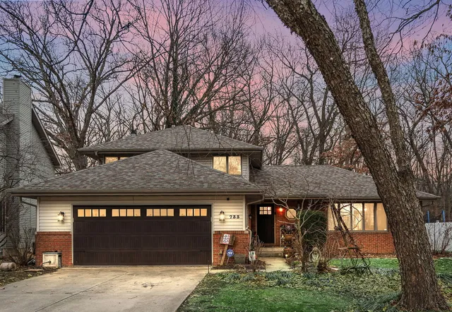 a front view of a building with garden