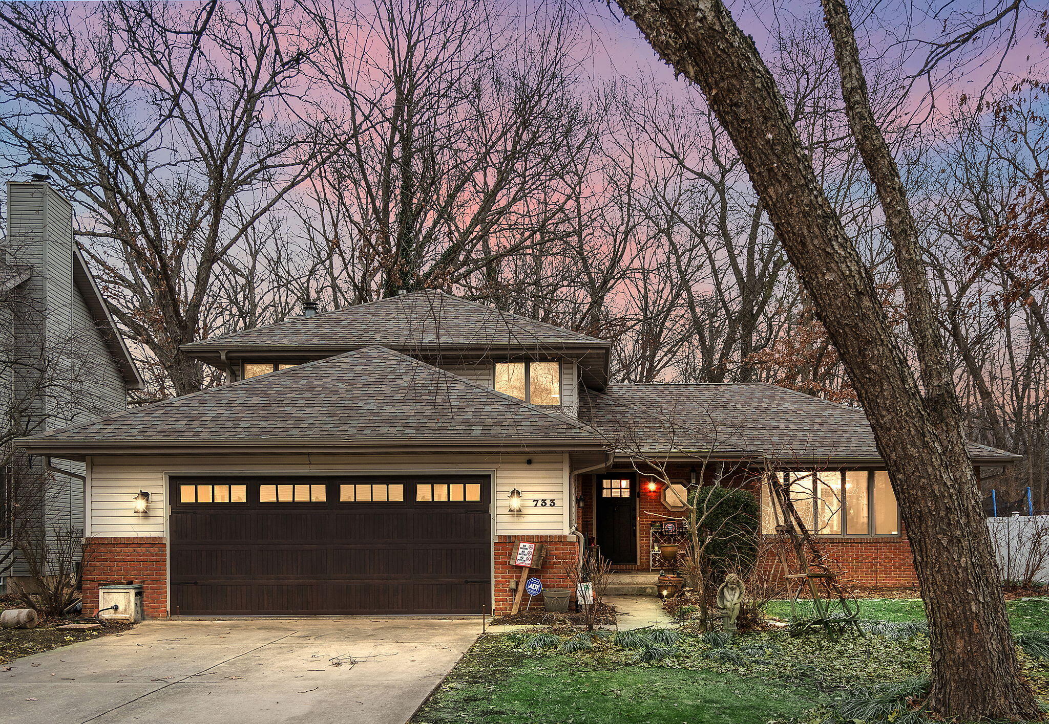 a front view of a building with garden