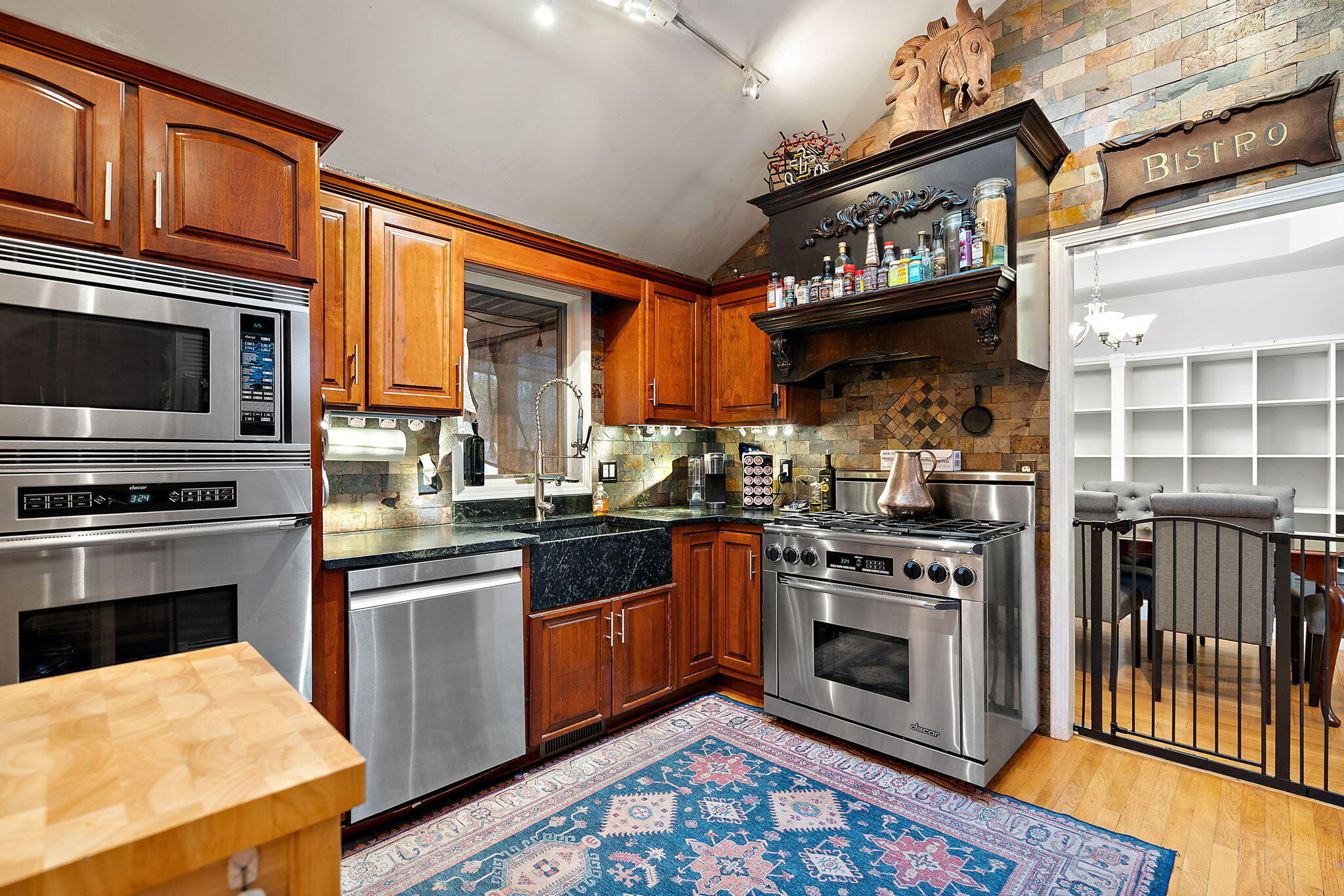 733 South Indiana Avenue Griffith, IN 46319 - Photo 13 of 48 a kitchen with stainless steel appliances granite countertop a stove top oven a sink and dishwasher