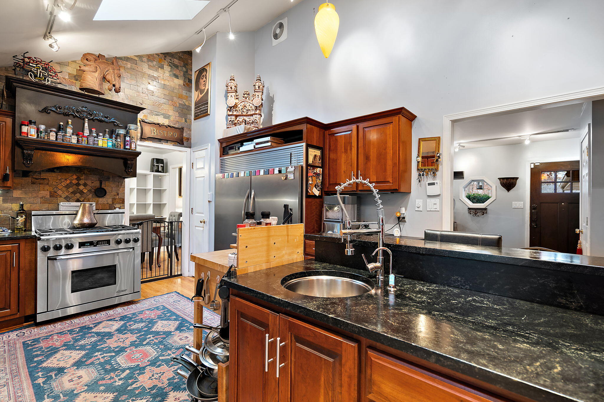 733 South Indiana Avenue Griffith, IN 46319 - Photo 15 of 48 a kitchen with stainless steel appliances granite countertop a sink stove and refrigerator