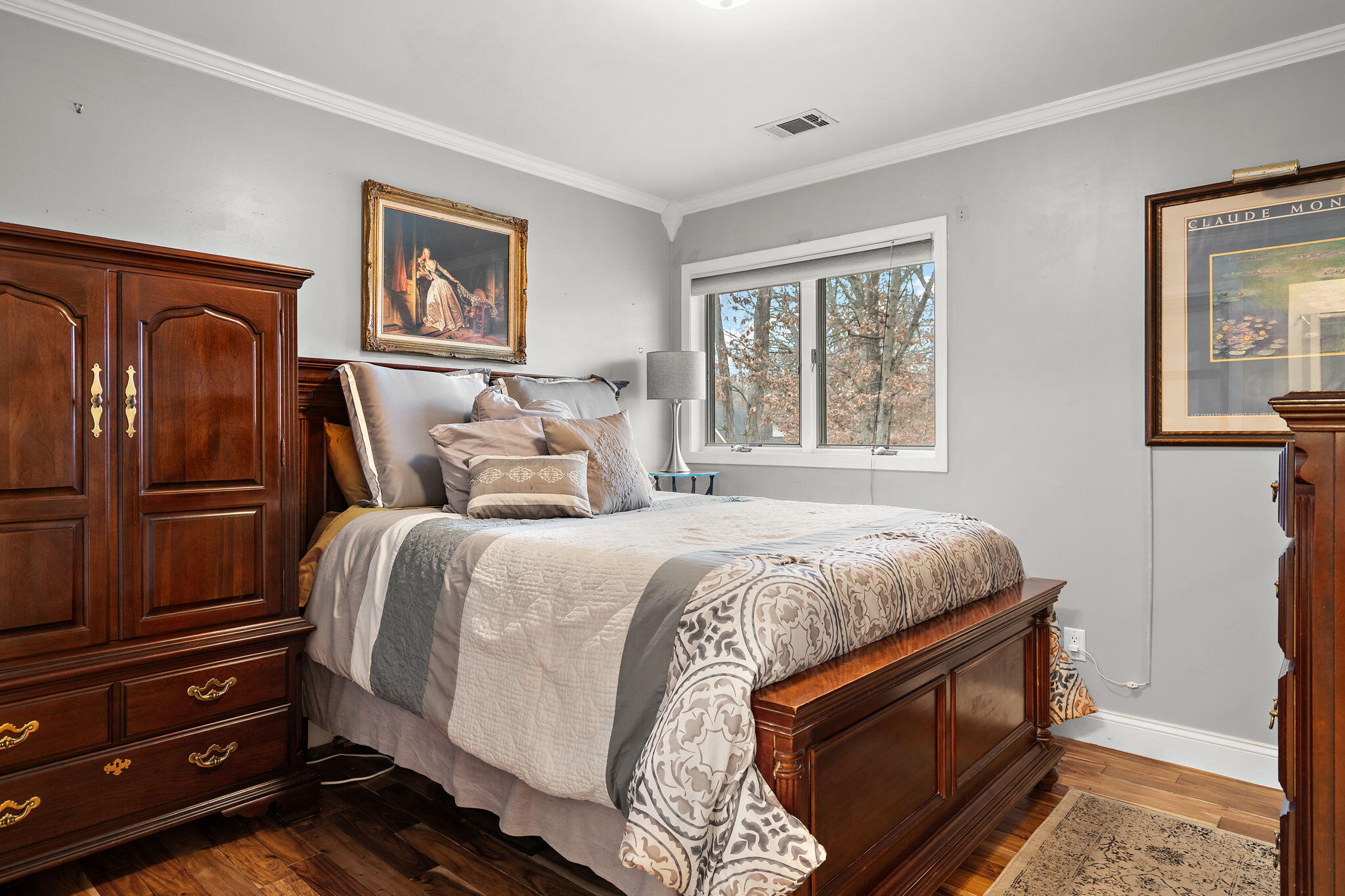 733 South Indiana Avenue Griffith, IN 46319 - Photo 22 of 48 a bedroom with a bed and wooden floor