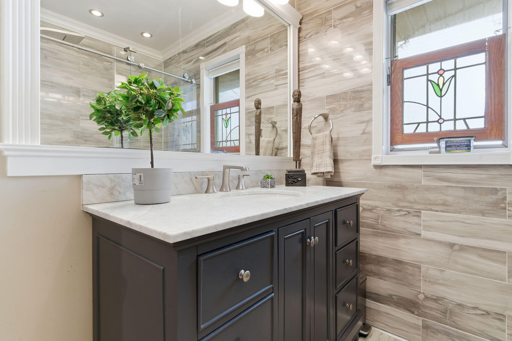 733 South Indiana Avenue Griffith, IN 46319 - Photo 24 of 48 a bathroom with a sink and a mirror