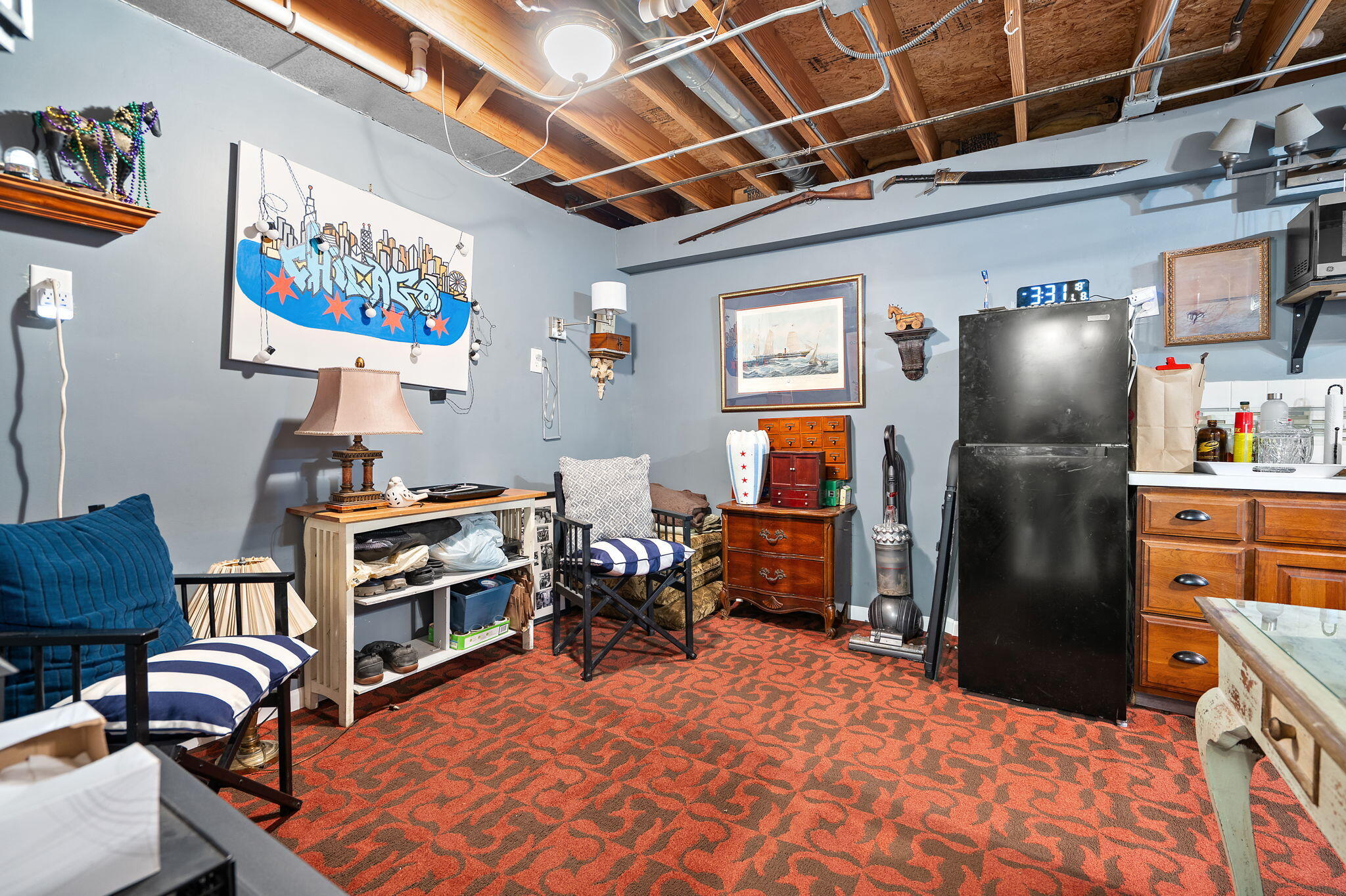 733 South Indiana Avenue Griffith, IN 46319 - Photo 33 of 48 a room with furniture and a flat screen tv