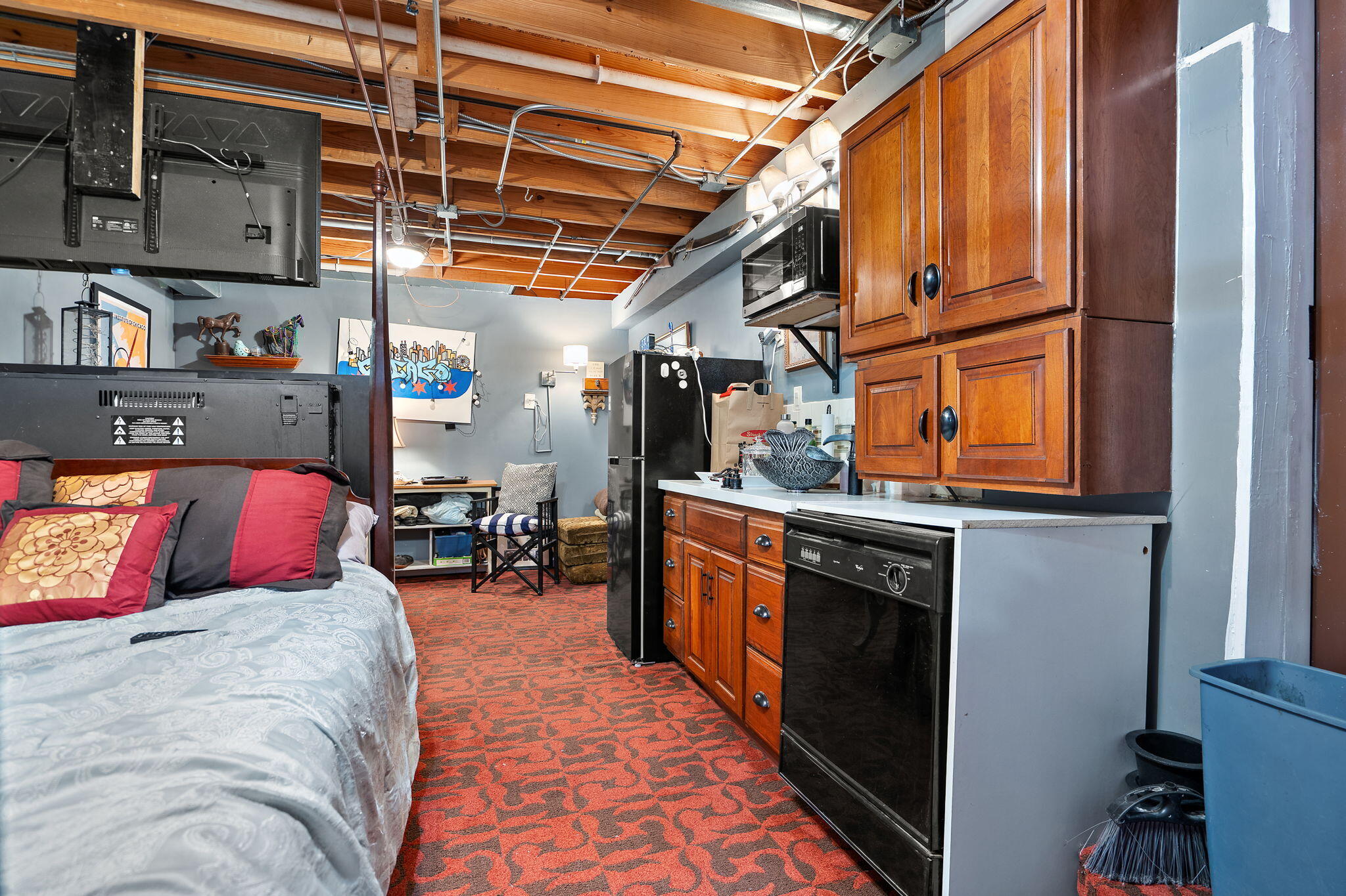 733 South Indiana Avenue Griffith, IN 46319 - Photo 36 of 48 a bed room with a bed and a refrigerator