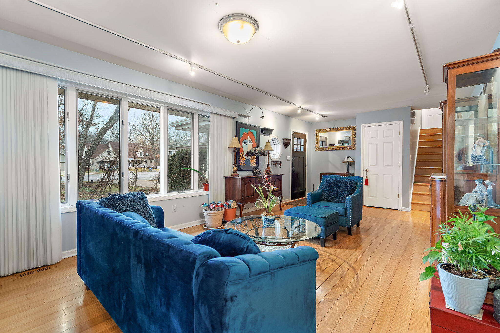 733 South Indiana Avenue Griffith, IN 46319 - Photo 7 of 48 a living room with furniture and a floor to ceiling window