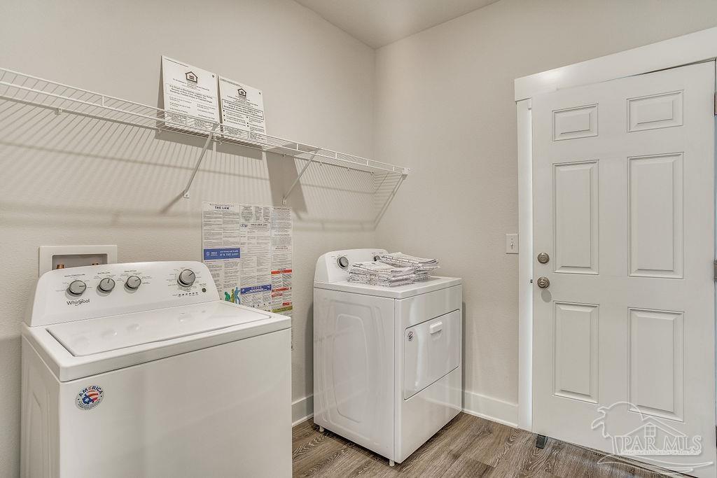 7757 Saddlebrook Avenue Pace, FL 32571 - Photo 16 of 28 a utility room with dryer and washer