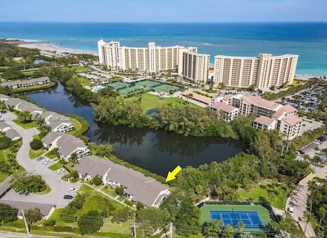 a view of a lake with a building in the background