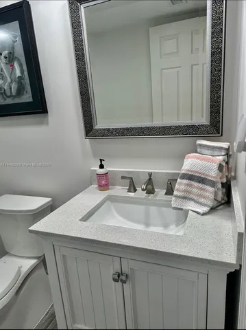 a bathroom with a sink and a toilet