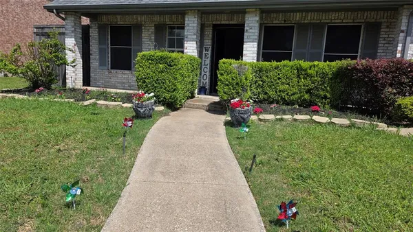 an empty room with fan and windows
