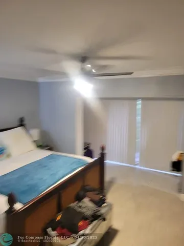 a room with pool table and a window