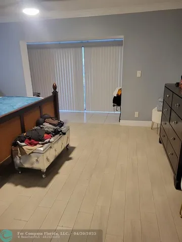 a room with a couch and a window