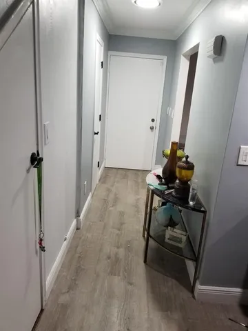 a lobby with furniture and a potted plant