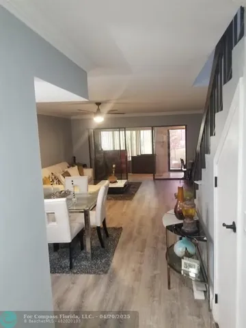 a lobby with furniture and a potted plant