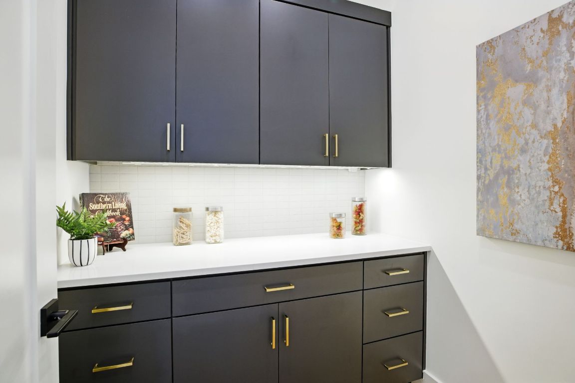 7009 Daugherty Street Austin, TX 78757 - Photo 15 of 33 a bathroom with a sink and a mirror