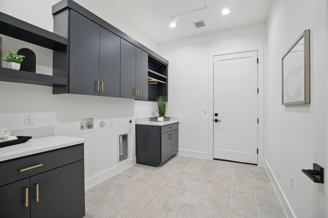 7009 Daugherty Street Austin, TX 78757 - Photo 28 of 33 a kitchen with stainless steel appliances granite countertop a sink stove and cabinets