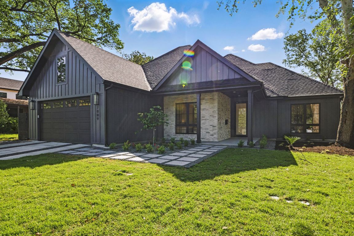 7009 Daugherty Street Austin, TX 78757 - Photo 3 of 33 a view of a yard in front of house