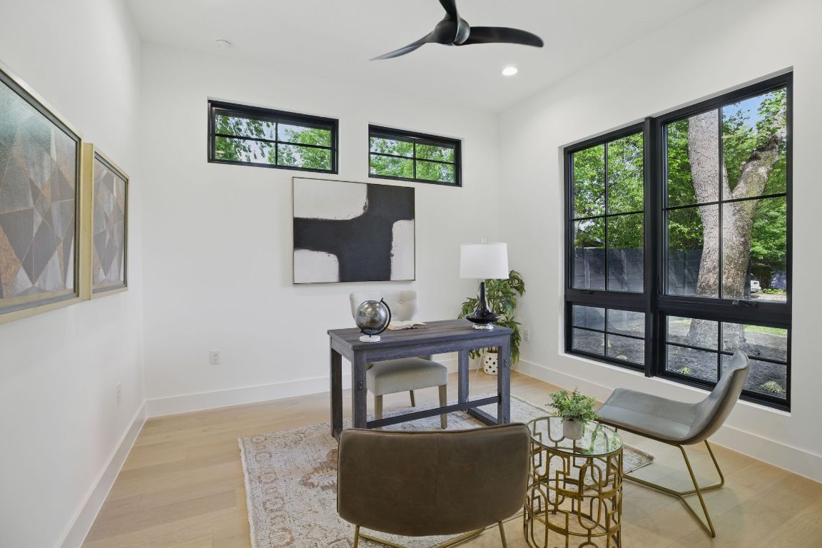 7009 Daugherty Street Austin, TX 78757 - Photo 4 of 33 a living room with furniture and a window