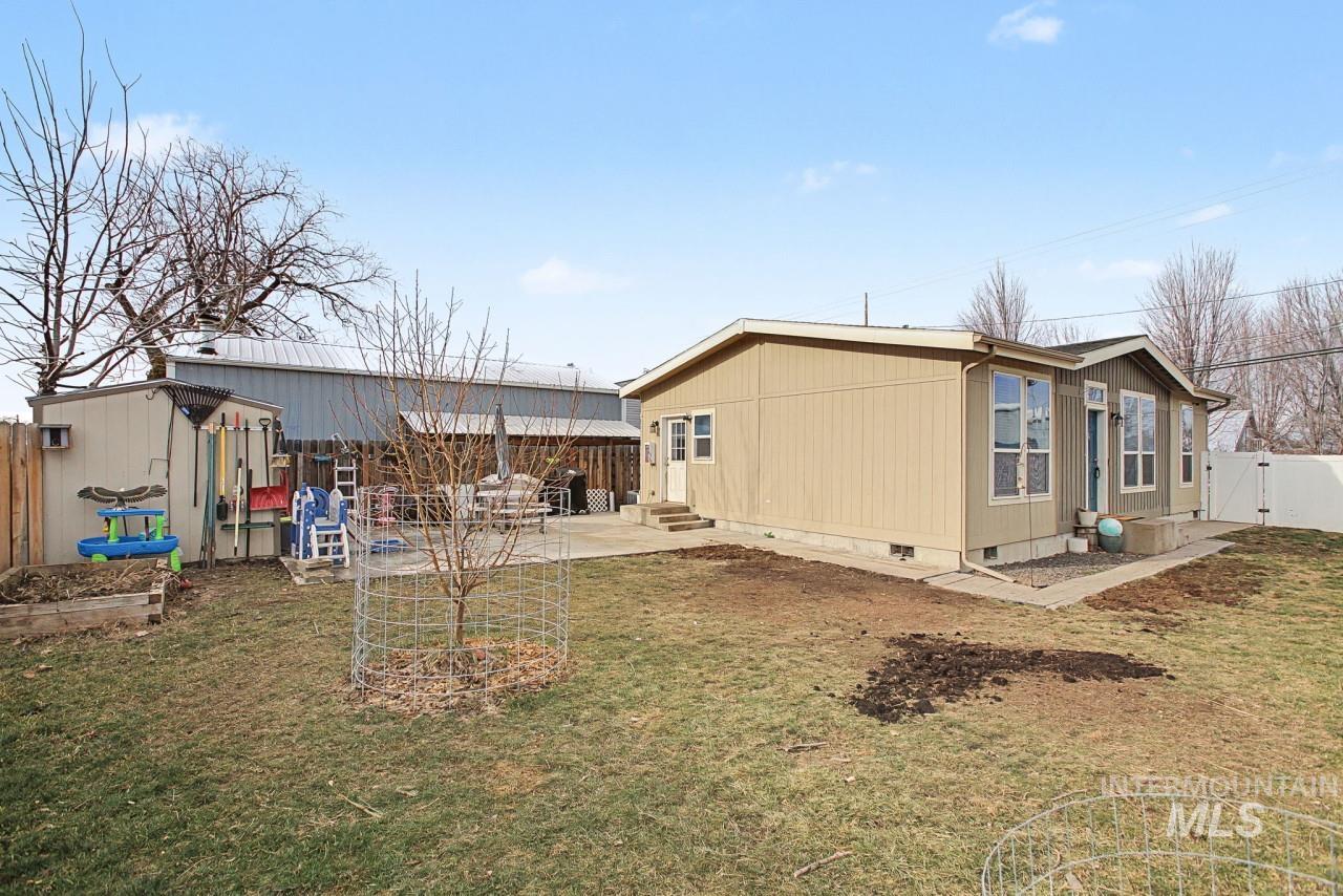 1224 1/2 Burrell Avenue Lewiston, ID 83501 - Photo 21 of 28 Back of property featuring crawl space, a fenced backyard, a gate, and a patio