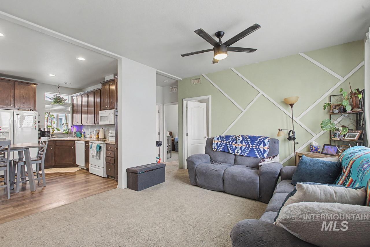 1224 1/2 Burrell Avenue Lewiston, ID 83501 - Photo 3 of 28 Living room with a ceiling fan, light carpet, and recessed lighting