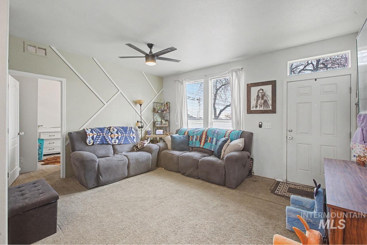 1224 1/2 Burrell Avenue Lewiston, ID 83501 - Photo 4 of 28 Carpeted living area with a ceiling fan