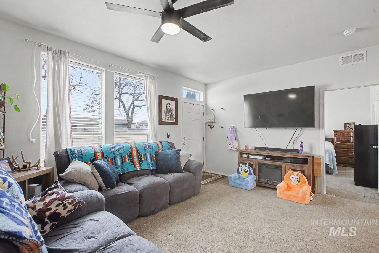 1224 1/2 Burrell Avenue Lewiston, ID 83501 - Photo 5 of 28 Carpeted living room featuring a ceiling fan