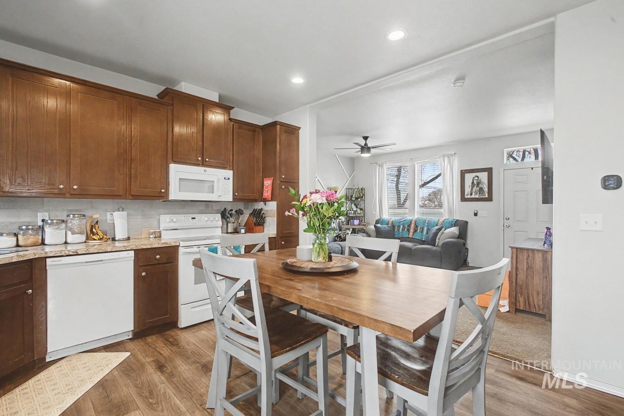 1224 1/2 Burrell Avenue Lewiston, ID 83501 - Photo 8 of 28 Kitchen featuring white appliances, dark wood-style flooring, ceiling fan, tasteful backsplash, and recessed lighting