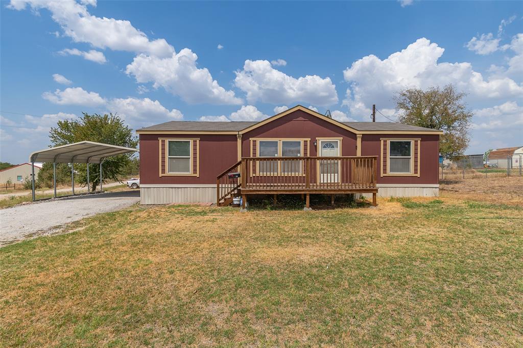 181 Sondra Lin Boulevard Decatur, TX 76234 - Photo 1 of 1 Manufactured / mobile home with a front lawn, a deck, and a carport