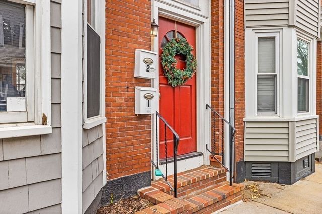 a front view of a house with a porch
