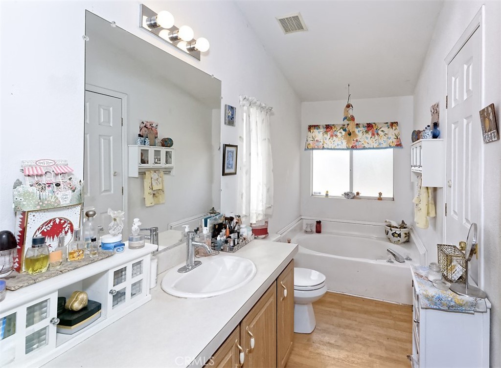 1895 Barkley Ranch Road Pinon Hills, CA 92372 - Photo 13 of 31 a bathroom with a granite countertop sink a toilet and shower