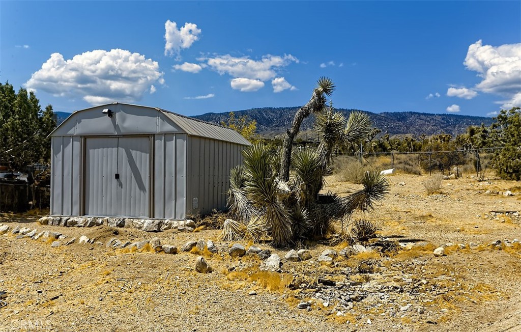1895 Barkley Ranch Road Pinon Hills, CA 92372 - Photo 20 of 31 a view of a house with a yard