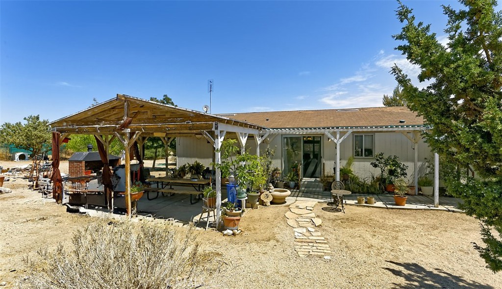 1895 Barkley Ranch Road Pinon Hills, CA 92372 - Photo 21 of 31 a view of a house with a patio