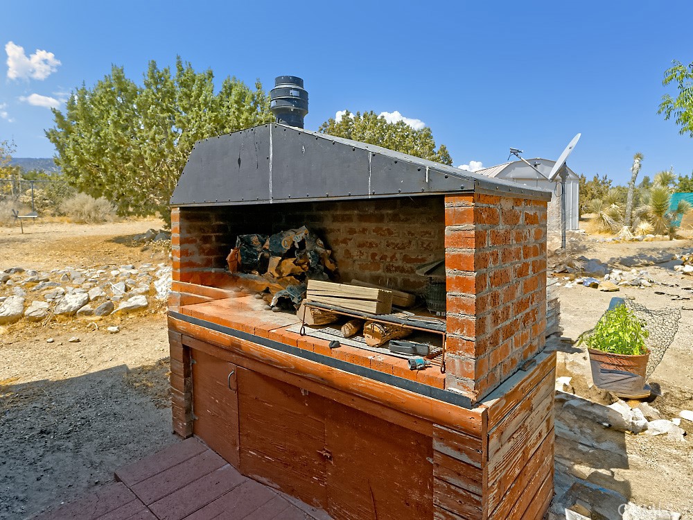 1895 Barkley Ranch Road Pinon Hills, CA 92372 - Photo 23 of 31 a view of a chairs and table on the terrace