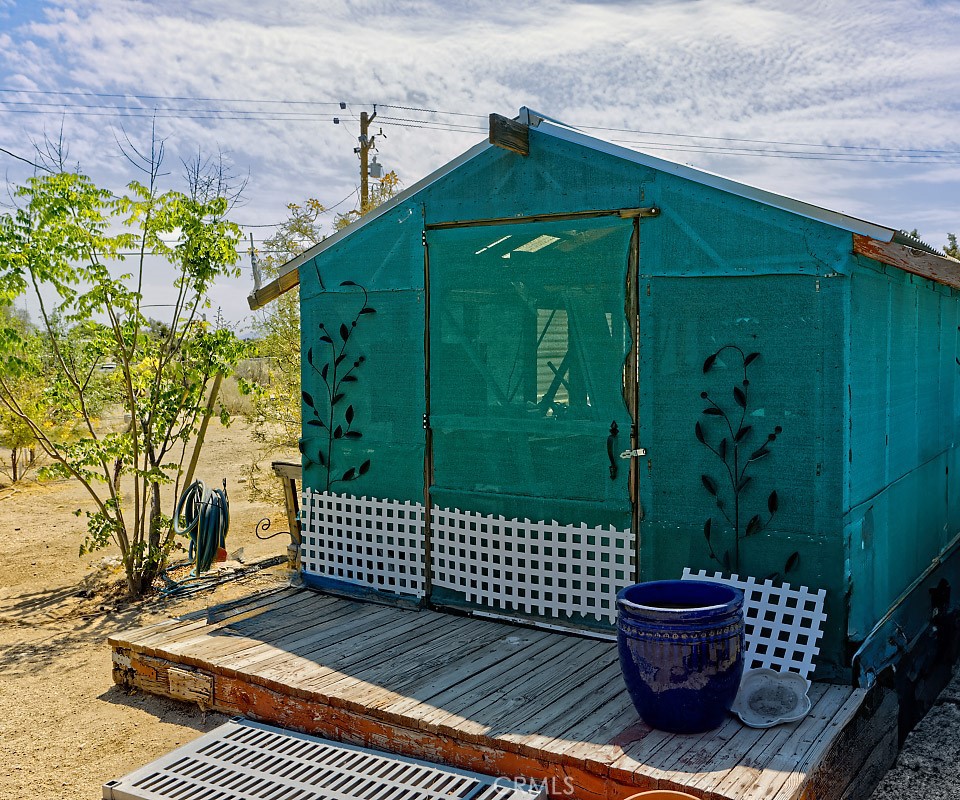 1895 Barkley Ranch Road Pinon Hills, CA 92372 - Photo 28 of 31 a view of a wooden door and a yard