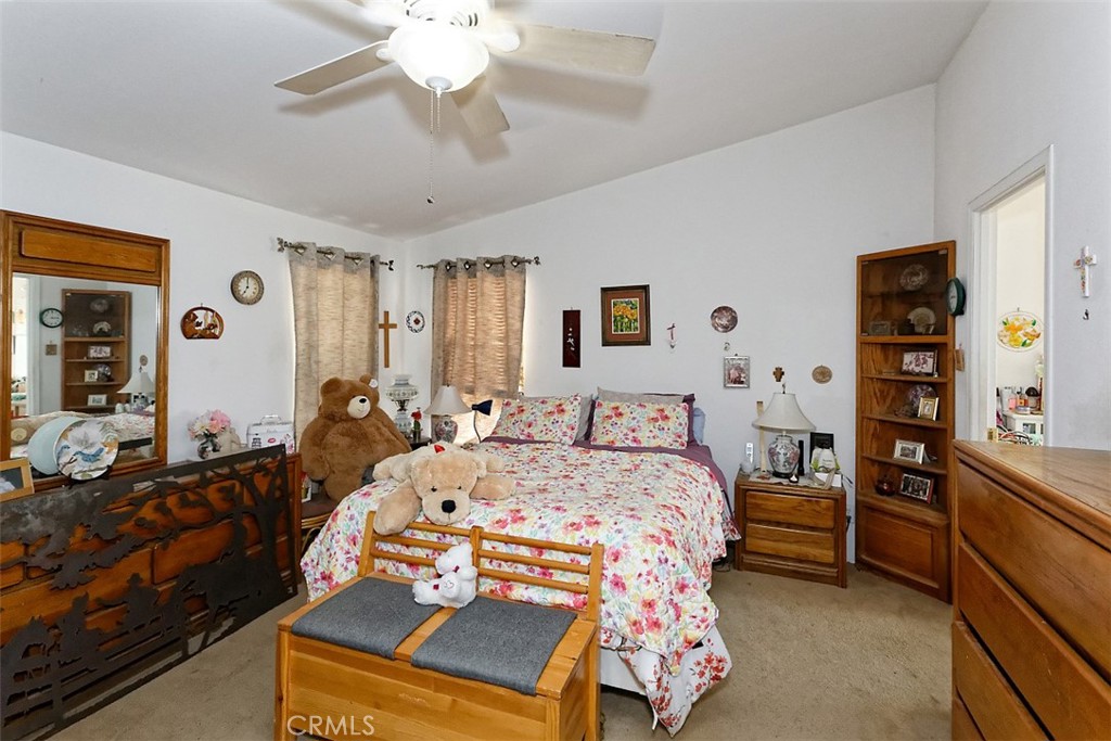1895 Barkley Ranch Road Pinon Hills, CA 92372 - Photo 10 of 31 a bedroom with a bed and furniture