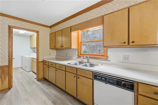 a kitchen with a sink and a window