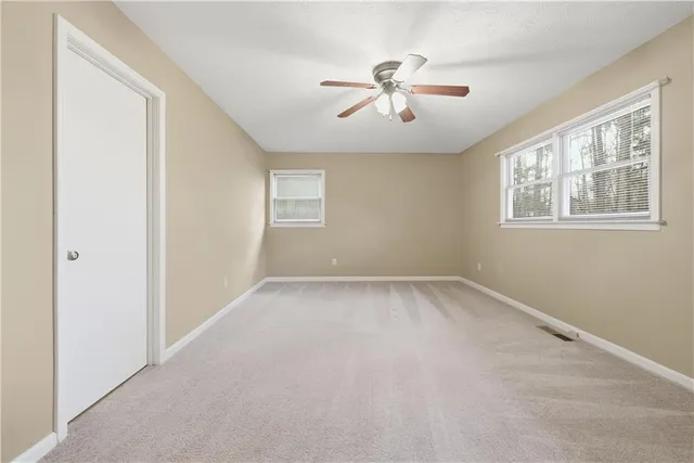 a view of empty room with windows