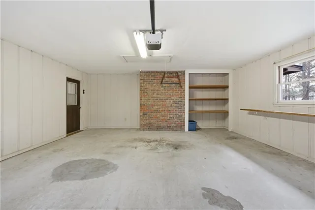 a view of room with walk in closet and window