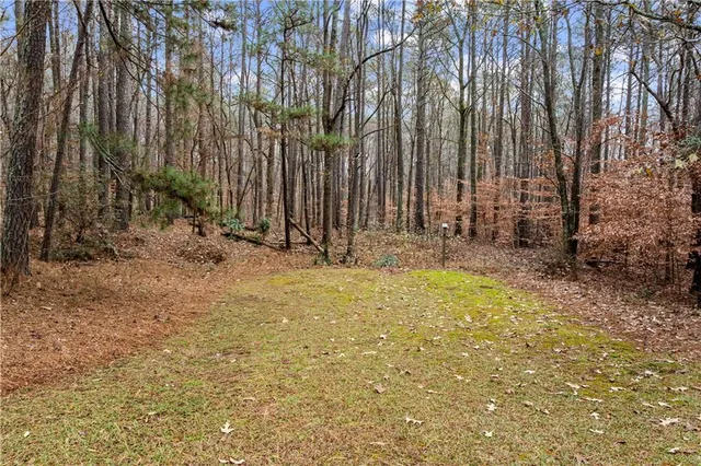 a view of wooden fence and trees