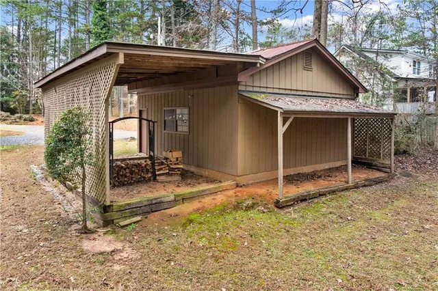 a view of a house with wooden fence