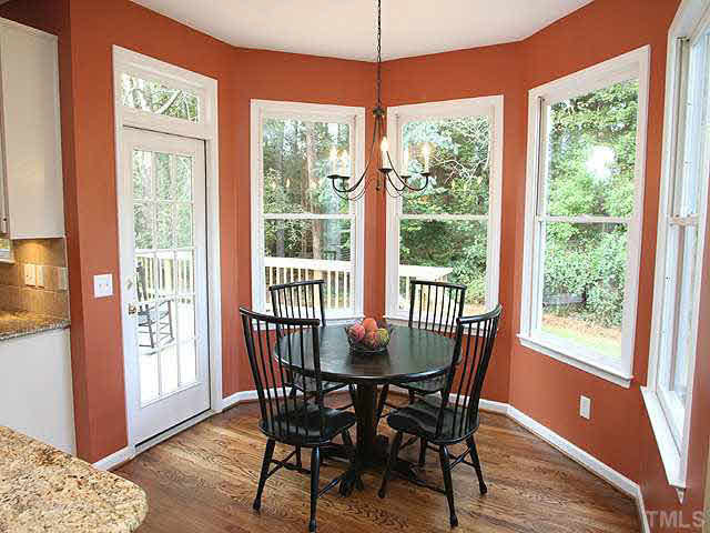 8405 Evans Mill Place Raleigh, NC 27613 - Photo 6 of 25 The large, sunny breakfast room overlooks the family room and out over the deck to the tree-lined backyard. Breakfast Area