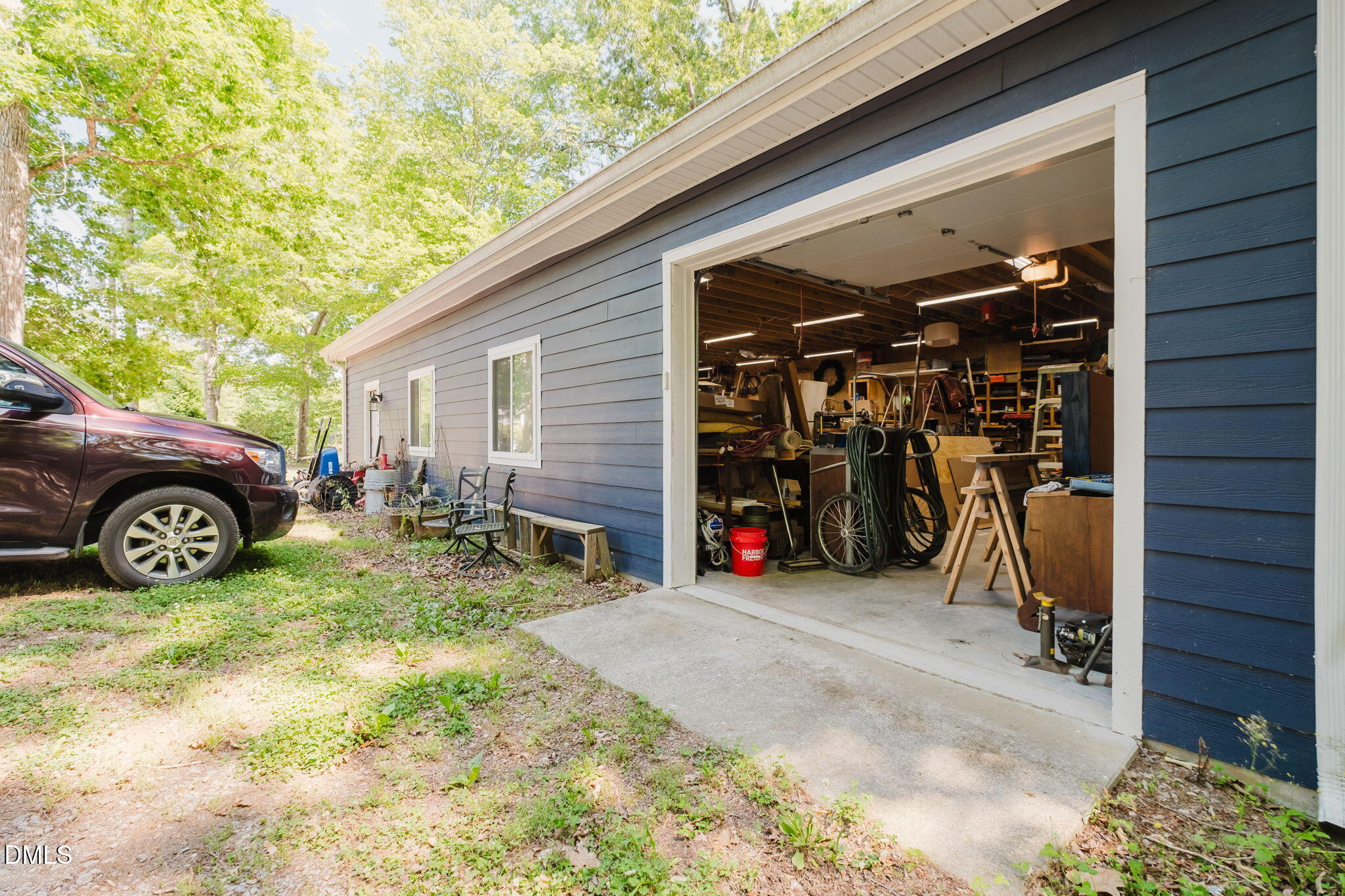 370 Robinson Ferry Road Macon, NC 27551 - Photo 56 of 85 a view of a garage with parked cars