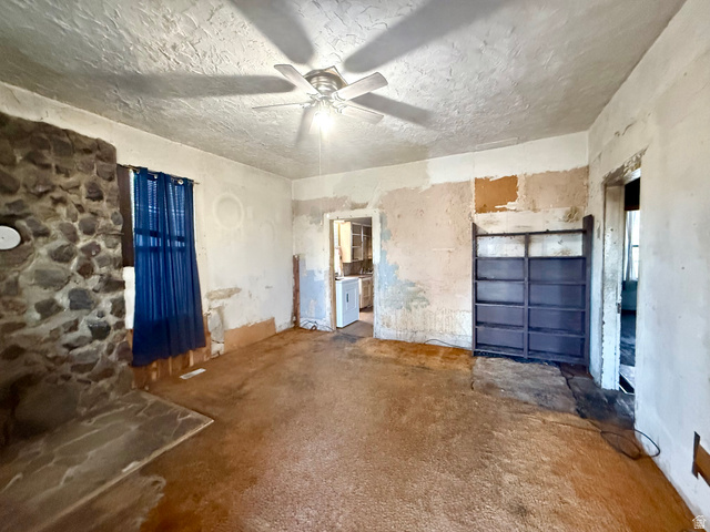 274 West Oneida Street Preston, ID 83263 - Photo 5 of 6 Unfurnished living room with ceiling fan and unfinished concrete flooring