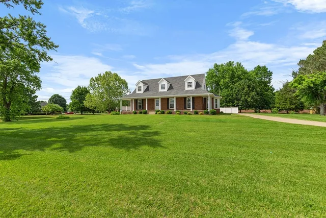 a kitchen with stainless steel appliances a refrigerator sink and cabinets