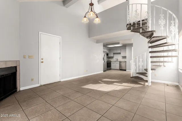 a view of a livingroom with a ceiling fan and window