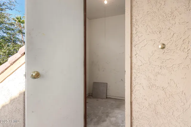 a front view of a house with garden and a garden