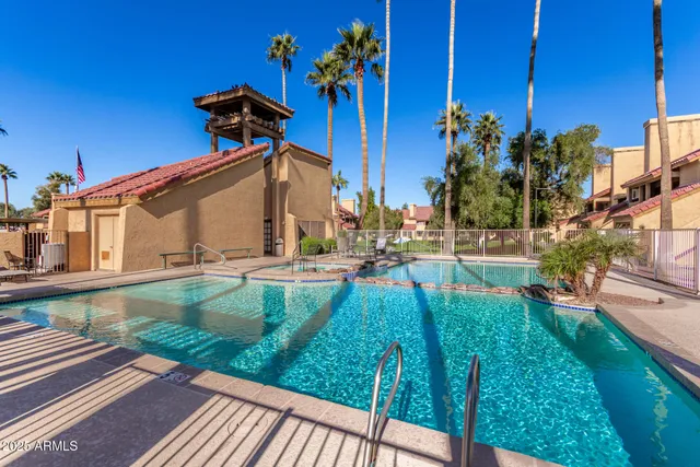 a view of a patio with chairs and a table with chairs