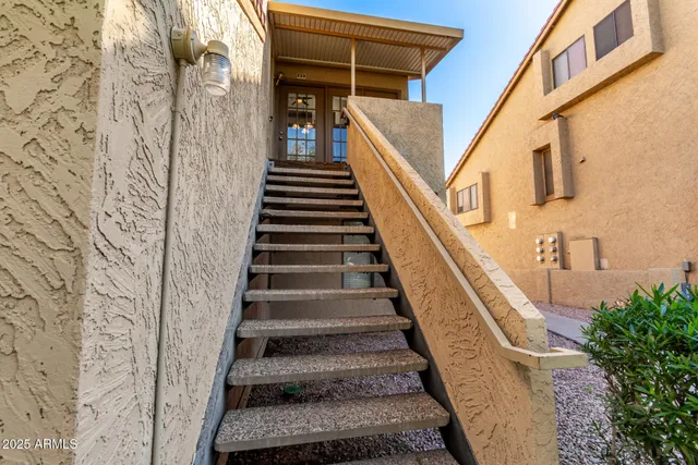 a kitchen with white cabinets and appliances